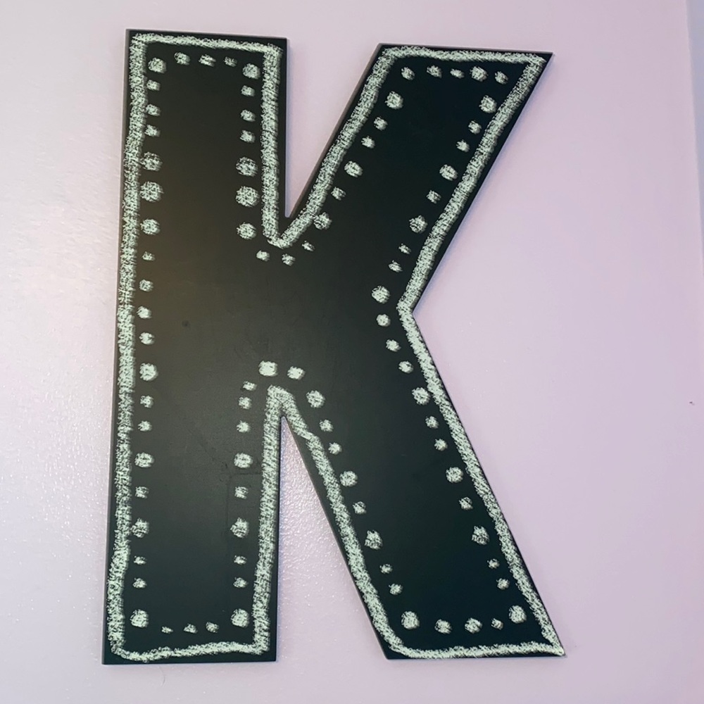K chalkboard sign